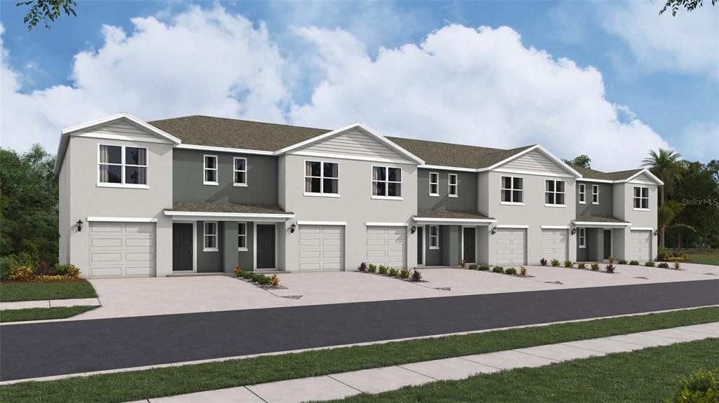 Front exterior of a new home in The Towns at Laurel Commons, Ocala, FL, highlighting curb appeal (Image 1). Front exterior of a new home in The Towns at Laurel Commons, Ocala, FL, highlighting curb appeal (Image 1).
