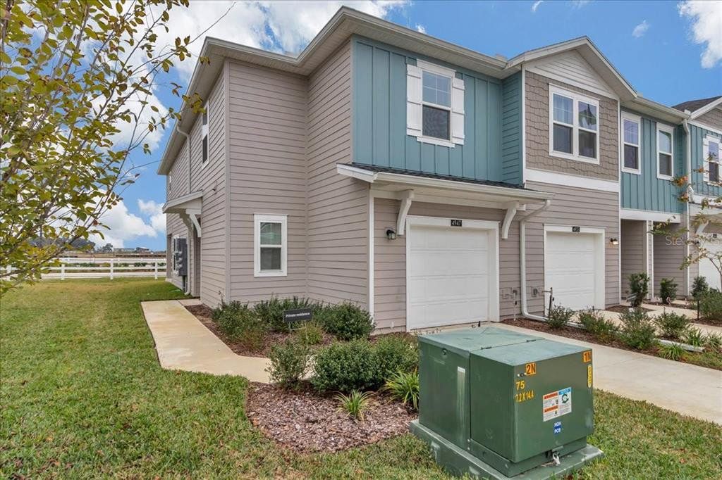 Front exterior of a new home in Marion Ranch, Ocala, FL, highlighting curb appeal (Image 1). Front exterior of a new home in Marion Ranch, Ocala, FL, highlighting curb appeal (Image 1).