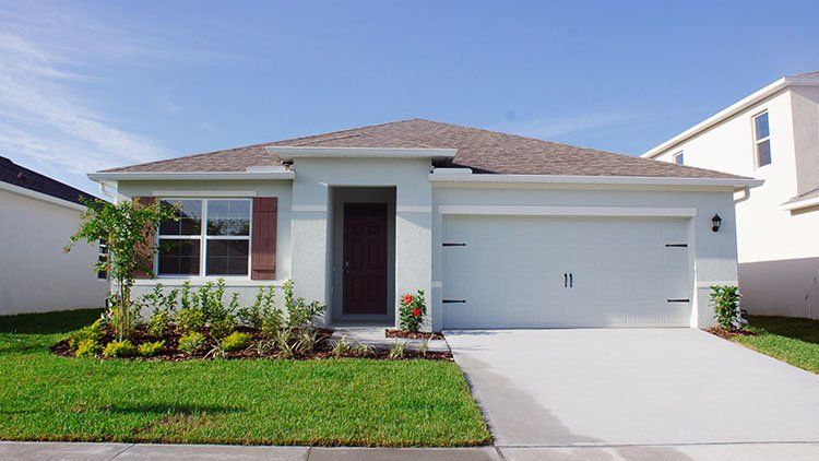 Front exterior of a new home in Wynnstone, Davenport, FL, highlighting curb appeal (Image 1). Front exterior of a new home in Wynnstone, Davenport, FL, highlighting curb appeal (Image 1).
