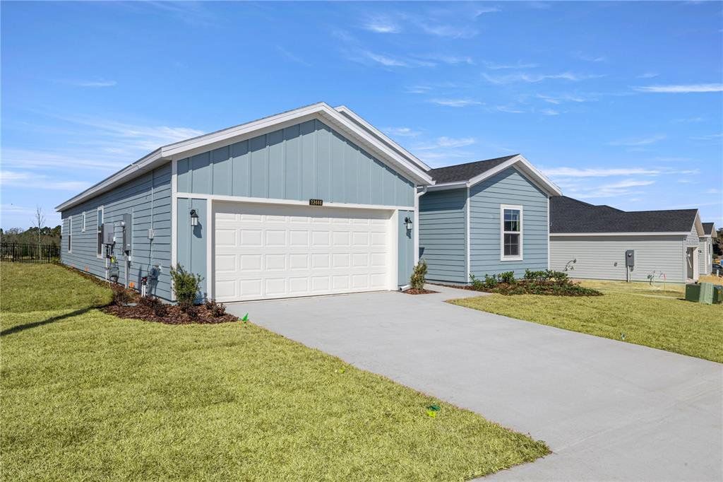Front exterior of a new home in Trailhead Landing, Alachua, FL, highlighting curb appeal (Image 1). Front exterior of a new home in Trailhead Landing, Alachua, FL, highlighting curb appeal (Image 1).