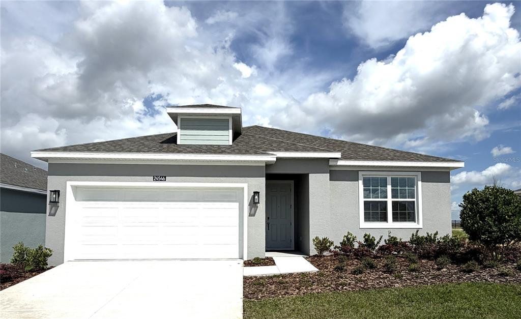 Front exterior of a new home in Hodges Reserve, Howey-in-the-Hills, FL, highlighting curb appeal (Image 1). Front exterior of a new home in Hodges Reserve, Howey-in-the-Hills, FL, highlighting curb appeal (Image 1).