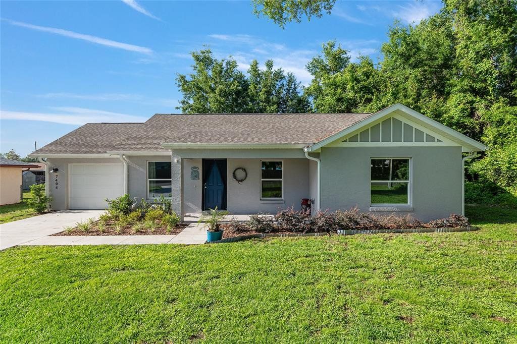 Front exterior of a new home in , Belleview, FL, highlighting curb appeal (Image 1). Front exterior of a new home in , Belleview, FL, highlighting curb appeal (Image 1).