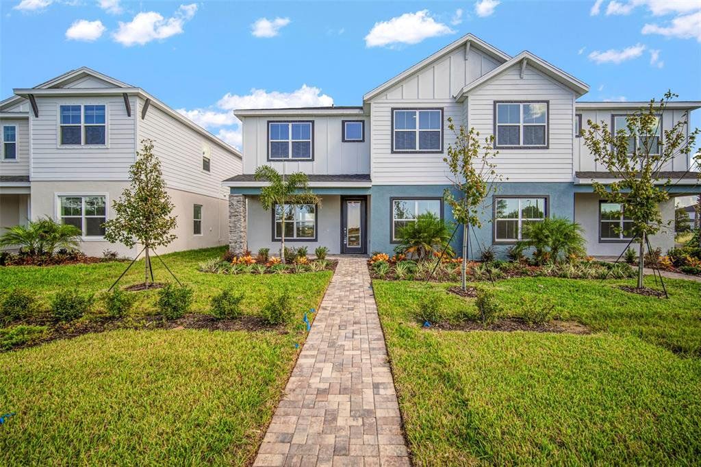Front exterior of a new home in North River Ranch, Parrish, FL, highlighting curb appeal (Image 1). Front exterior of a new home in North River Ranch, Parrish, FL, highlighting curb appeal (Image 1).
