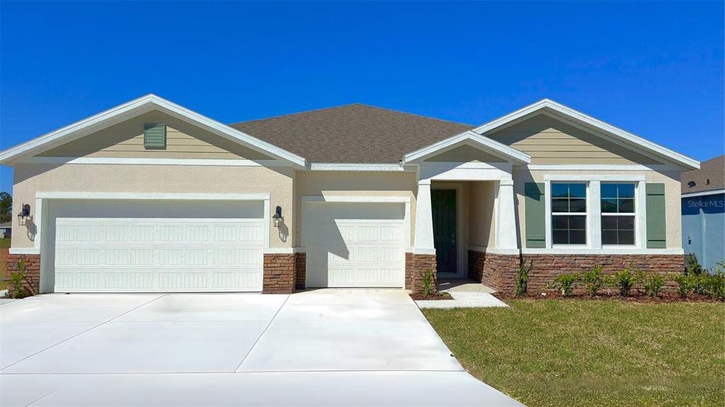 Front exterior of a new home in Archers Mill, Ormond Beach, FL, highlighting curb appeal (Image 1). Front exterior of a new home in Archers Mill, Ormond Beach, FL, highlighting curb appeal (Image 1).