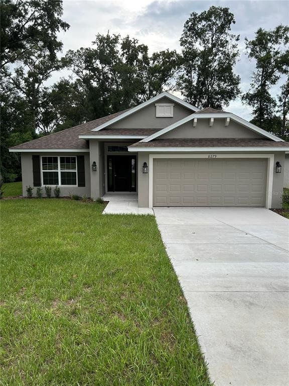 Front exterior of a new home in Orange Blossom Hills, Summerfield, FL, highlighting curb appeal (Image 1). Front exterior of a new home in Orange Blossom Hills, Summerfield, FL, highlighting curb appeal (Image 1).