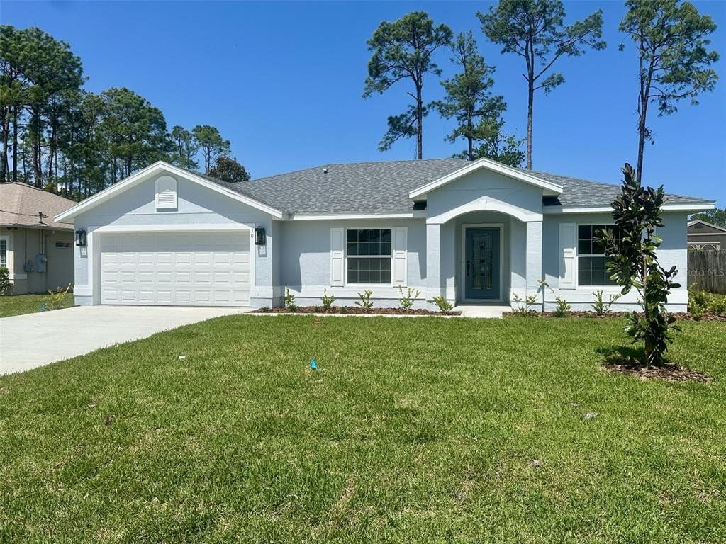 Front exterior of a new home in , Palm Coast, FL, highlighting curb appeal (Image 1). Front exterior of a new home in , Palm Coast, FL, highlighting curb appeal (Image 1).