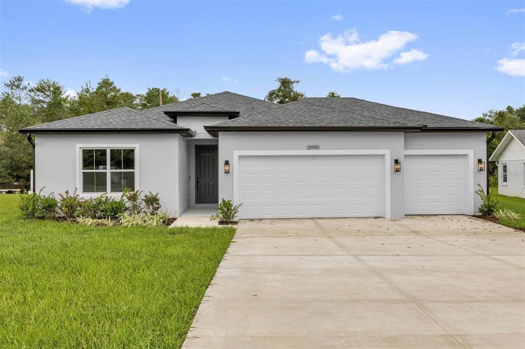 Front exterior of a new home in , Ocala, FL, highlighting curb appeal (Image 1). Front exterior of a new home in , Ocala, FL, highlighting curb appeal (Image 1).
