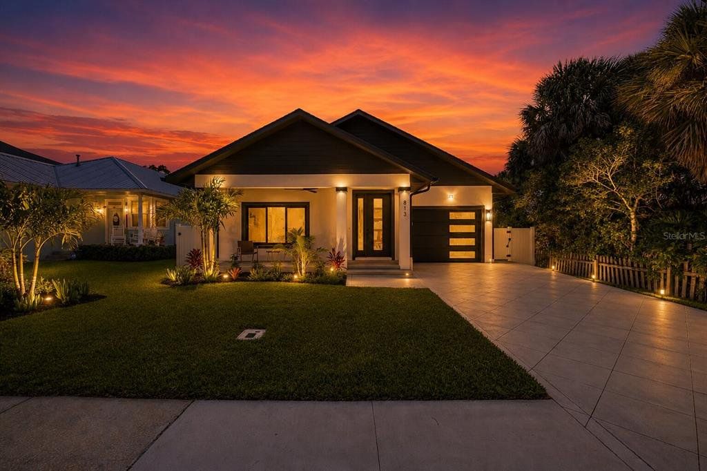 Front exterior of a new home in , New Smyrna Beach, FL, highlighting curb appeal (Image 1). Front exterior of a new home in , New Smyrna Beach, FL, highlighting curb appeal (Image 1).