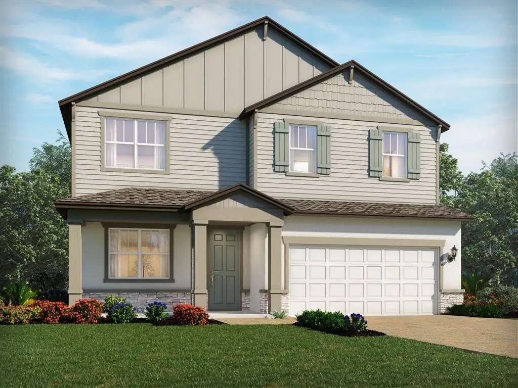 Front exterior of a new home in Legends Preserve - Signature Series, Daytona Beach, FL, highlighting curb appeal (Image 1).