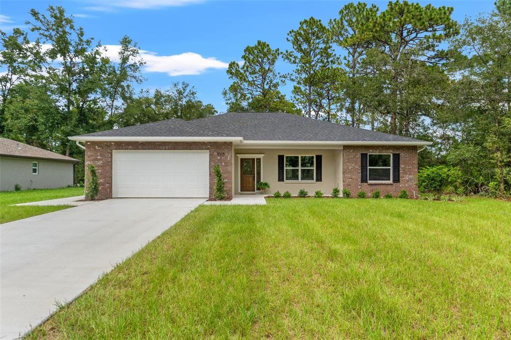 Front exterior of a new home in , Citrus Springs, FL, highlighting curb appeal (Image 1). Front exterior of a new home in , Citrus Springs, FL, highlighting curb appeal (Image 1).