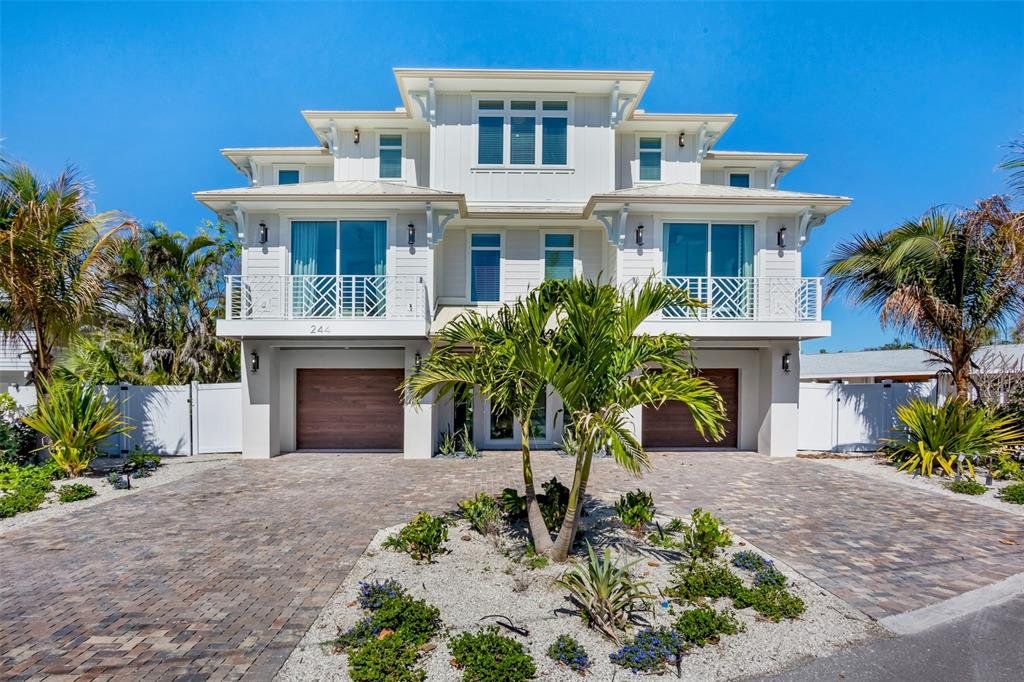 Front exterior of a new home in , Anna Maria, FL, highlighting curb appeal (Image 1). Front exterior of a new home in , Anna Maria, FL, highlighting curb appeal (Image 1).