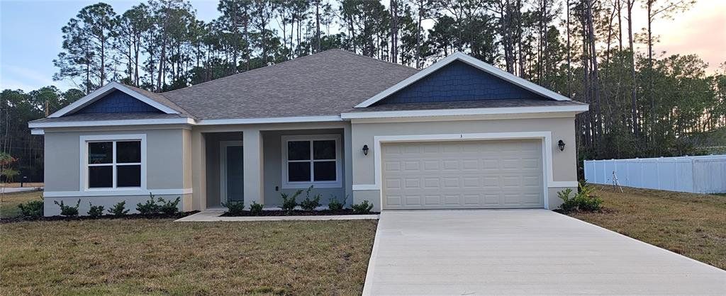 Front exterior of a new home in Palm Coast, Palm Coast, FL, highlighting curb appeal (Image 1). Front exterior of a new home in Palm Coast, Palm Coast, FL, highlighting curb appeal (Image 1).