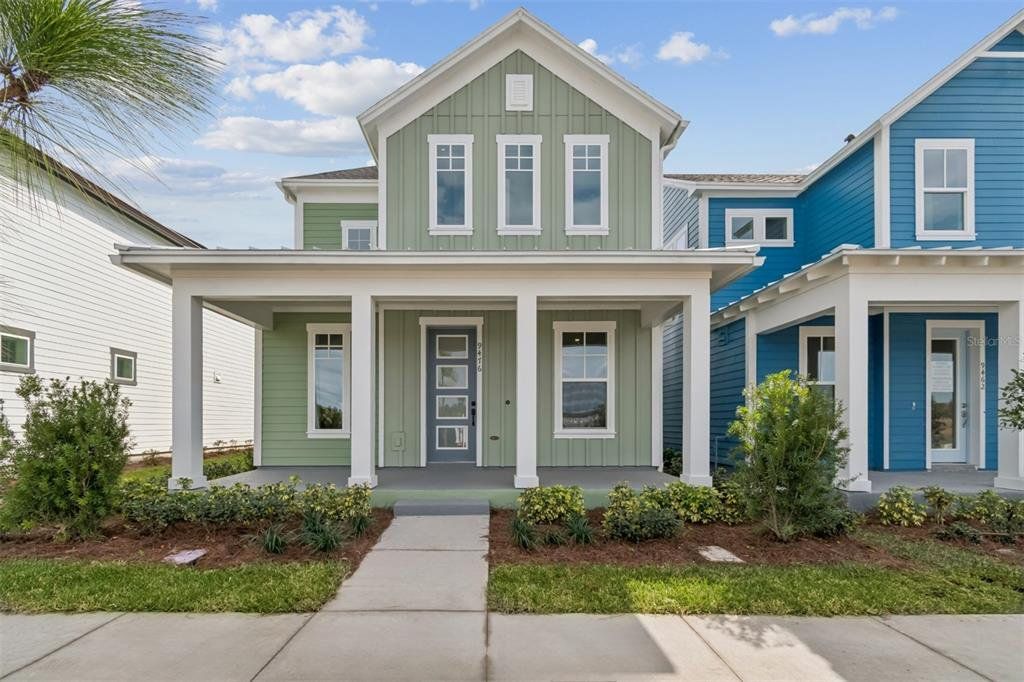 Front exterior of a new home in Laureate Park at Lake Nona - Garden Series, Orlando, FL, highlighting curb appeal (Image 1). Front exterior of a new home in Laureate Park at Lake Nona - Garden Series, Orlando, FL, highlighting curb appeal (Image 1).