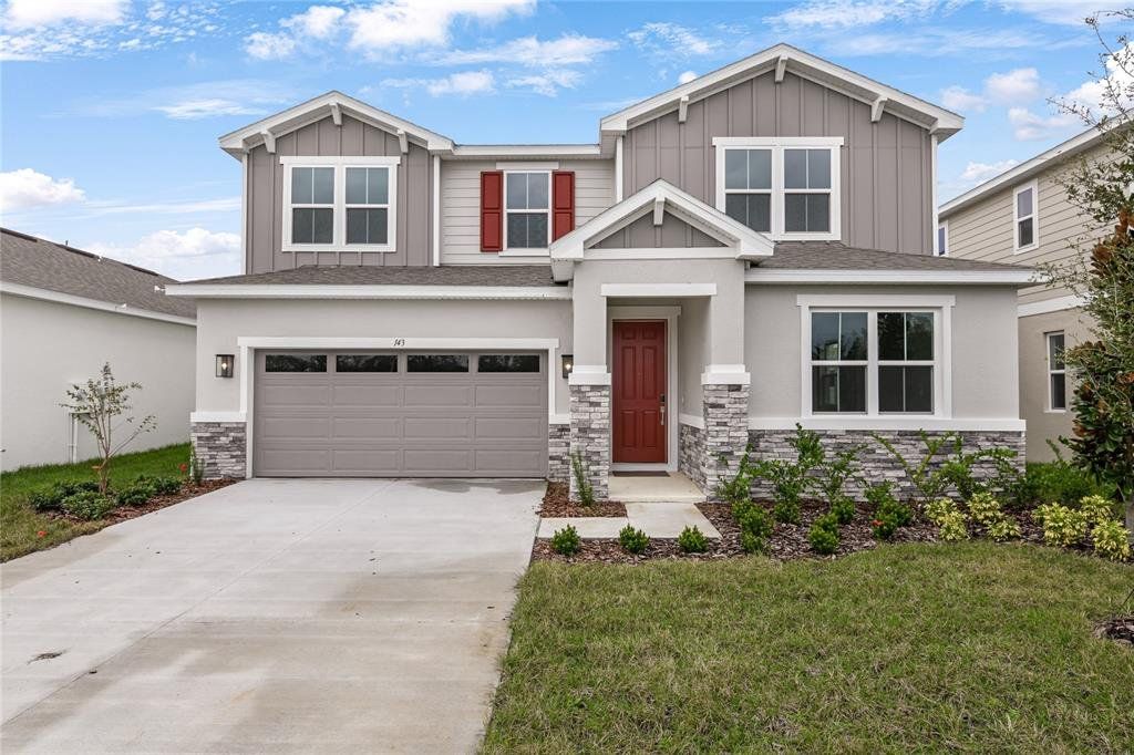 Front exterior of a new home in Waterstone, Tavares, FL, highlighting curb appeal (Image 1). Front exterior of a new home in Waterstone, Tavares, FL, highlighting curb appeal (Image 1).