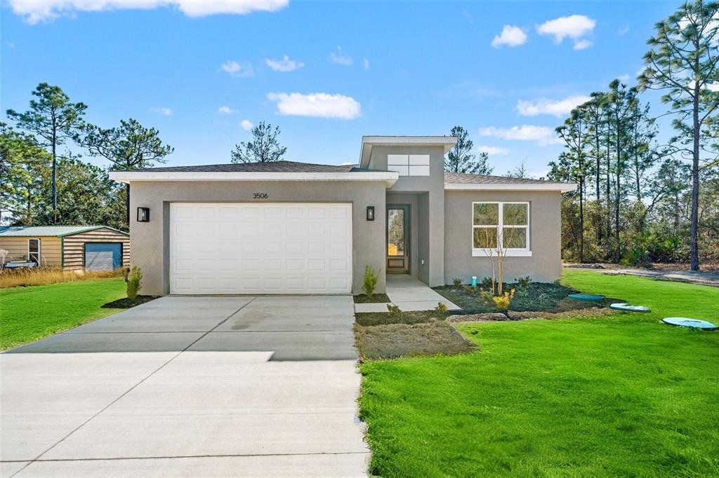 Front exterior of a new home in , Citrus Springs, FL, highlighting curb appeal (Image 1). Front exterior of a new home in , Citrus Springs, FL, highlighting curb appeal (Image 1).