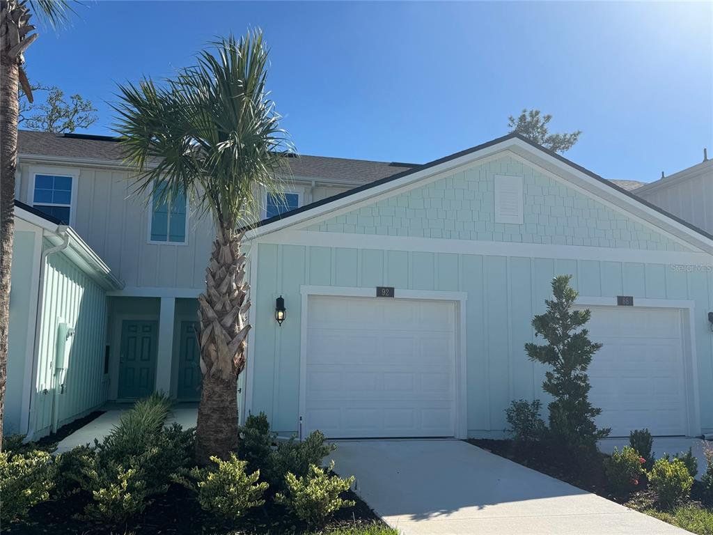 Front exterior of a new home in Bridgewater, St. Augustine, FL, highlighting curb appeal (Image 1).