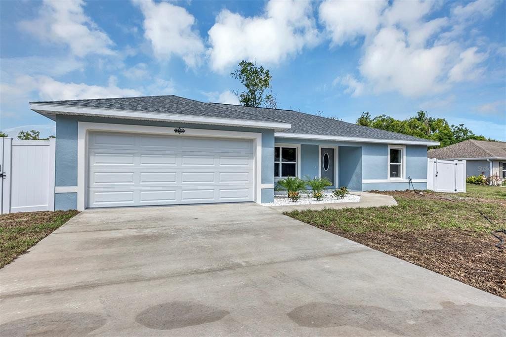 Front exterior of a new home in , Summerfield, FL, highlighting curb appeal (Image 1). Front exterior of a new home in , Summerfield, FL, highlighting curb appeal (Image 1).