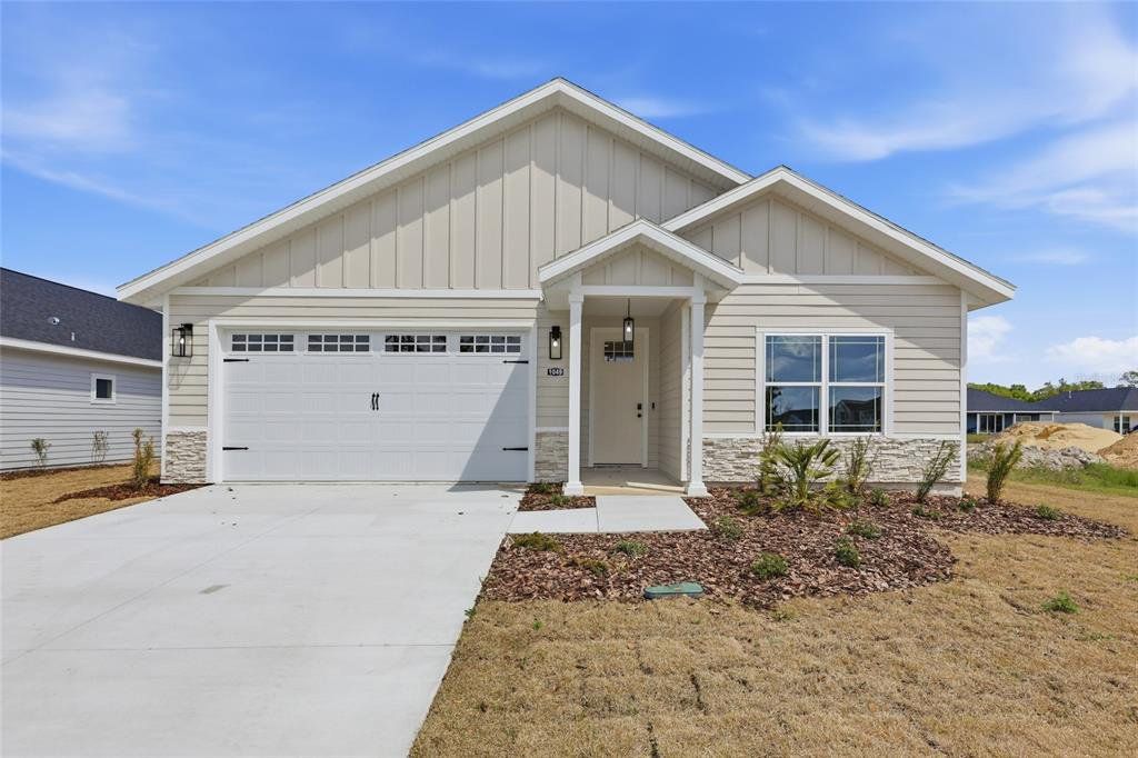 Front exterior of a new home in Grand Oaks, Gainesville, FL, highlighting curb appeal (Image 1). Front exterior of a new home in Grand Oaks, Gainesville, FL, highlighting curb appeal (Image 1).