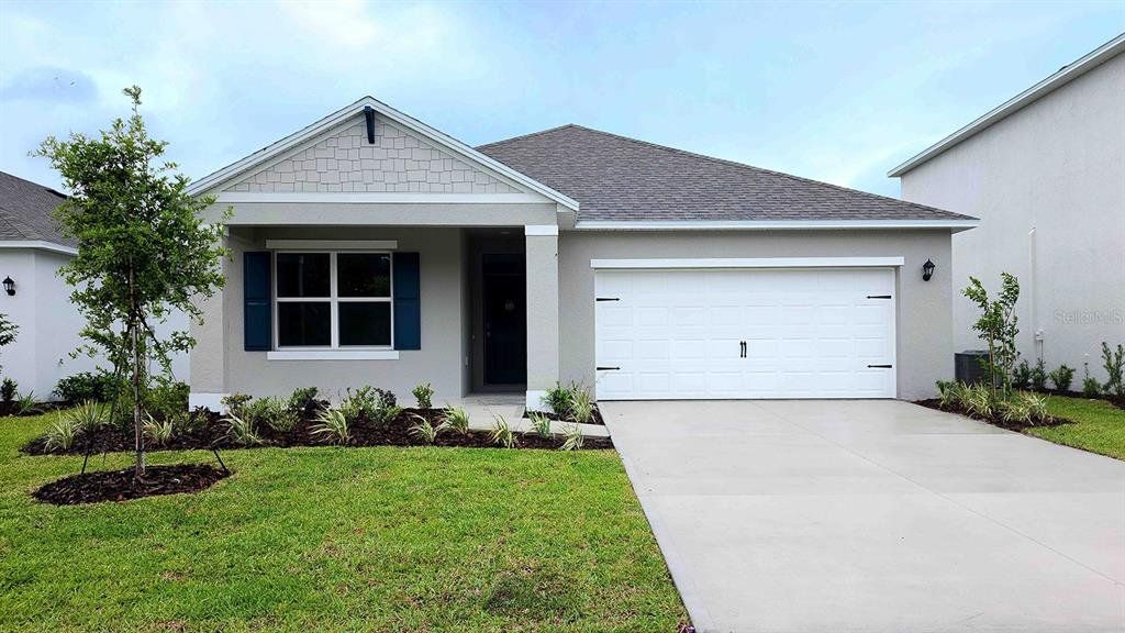 Front exterior of a new home in Ironwood, Daytona Beach, FL, highlighting curb appeal (Image 1). Front exterior of a new home in Ironwood, Daytona Beach, FL, highlighting curb appeal (Image 1).