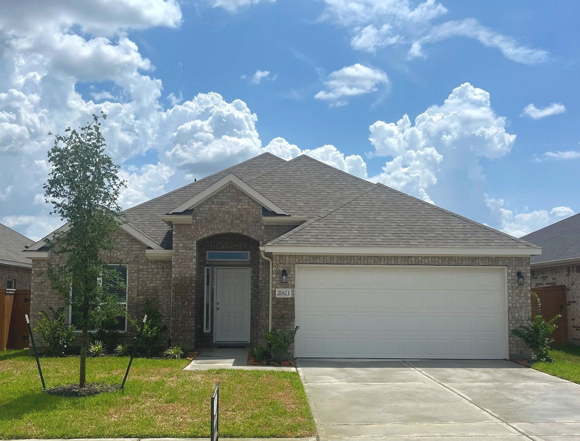 Front exterior of a new home in Cypress Green, Hockley, TX, highlighting curb appeal (Image 1). Front exterior of a new home in Cypress Green, Hockley, TX, highlighting curb appeal (Image 1).