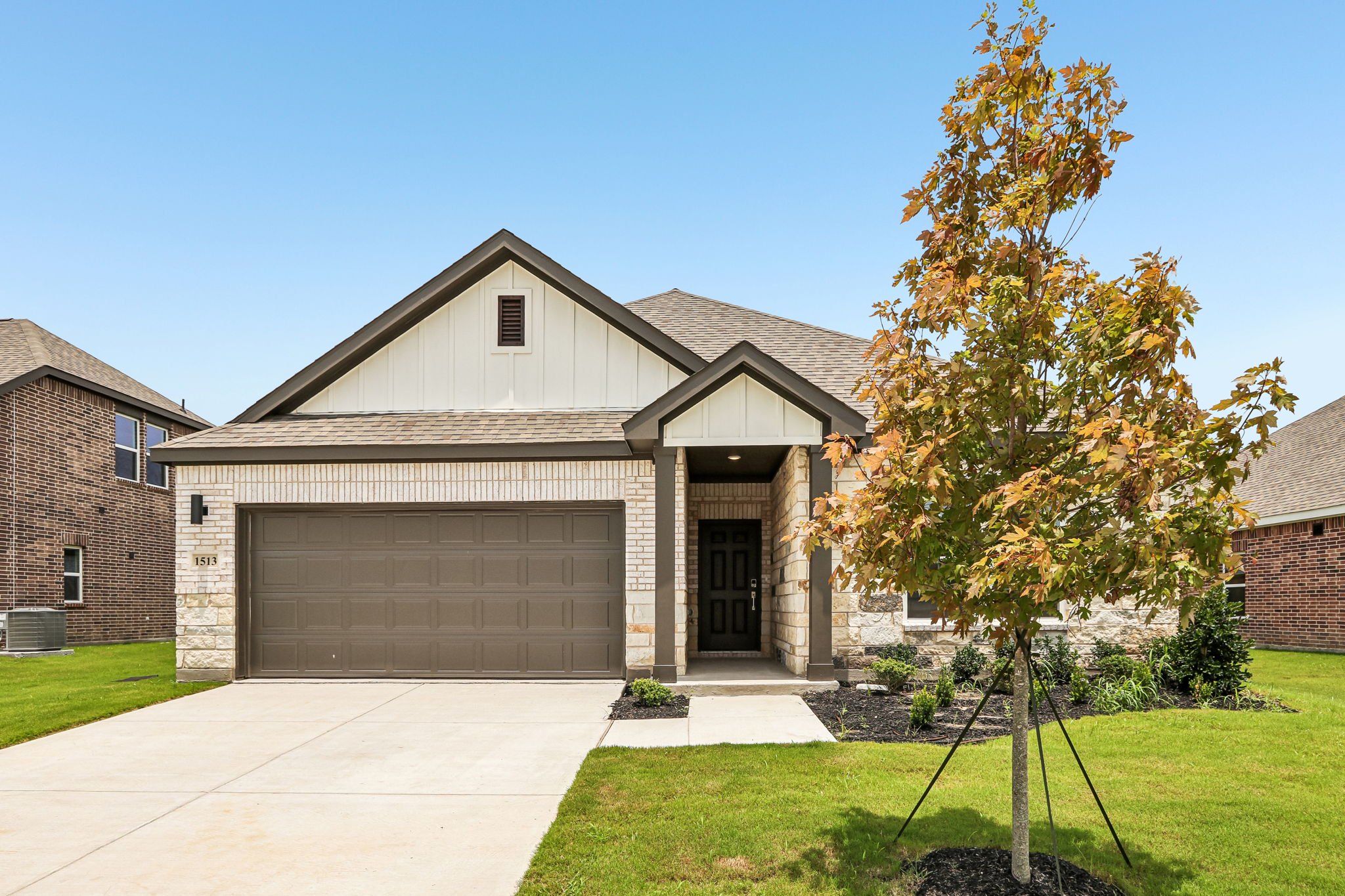 Front exterior of a new home in Anna Town Square, Anna, TX, highlighting curb appeal (Image 1). Front exterior of a new home in Anna Town Square, Anna, TX, highlighting curb appeal (Image 1).