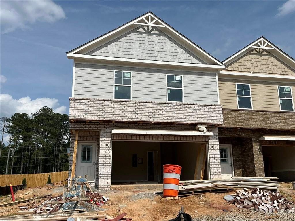 Front exterior of a new home in , Hoschton, GA, highlighting curb appeal (Image 1).