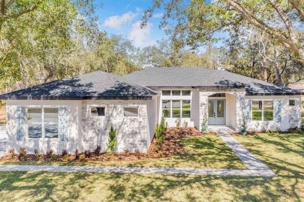 Front exterior of a new home in , Haines City, FL, highlighting curb appeal (Image 1). Front exterior of a new home in , Haines City, FL, highlighting curb appeal (Image 1).