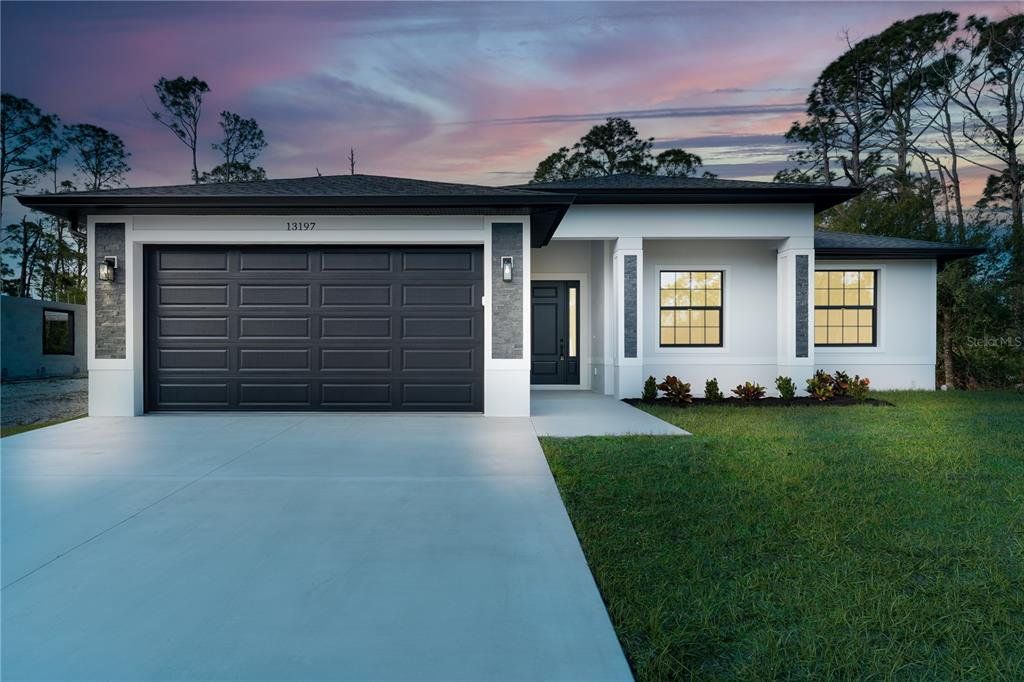 Front exterior of a new home in , Port Charlotte, FL, highlighting curb appeal (Image 1). Front exterior of a new home in , Port Charlotte, FL, highlighting curb appeal (Image 1).