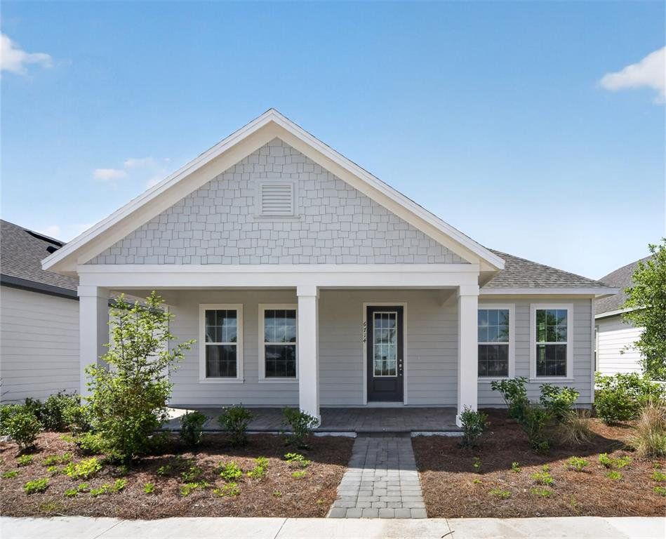 Front exterior of a new home in Weslyn Park, St. Cloud, FL, highlighting curb appeal (Image 1). Front exterior of a new home in Weslyn Park, St. Cloud, FL, highlighting curb appeal (Image 1).