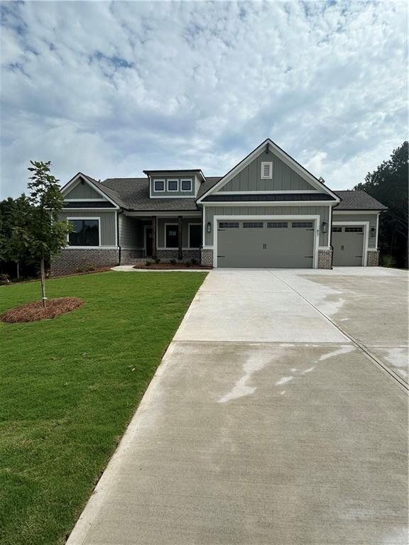 Front exterior of a new home in Riverwalk, Monroe, GA, highlighting curb appeal (Image 1). Front exterior of a new home in Riverwalk, Monroe, GA, highlighting curb appeal (Image 1).