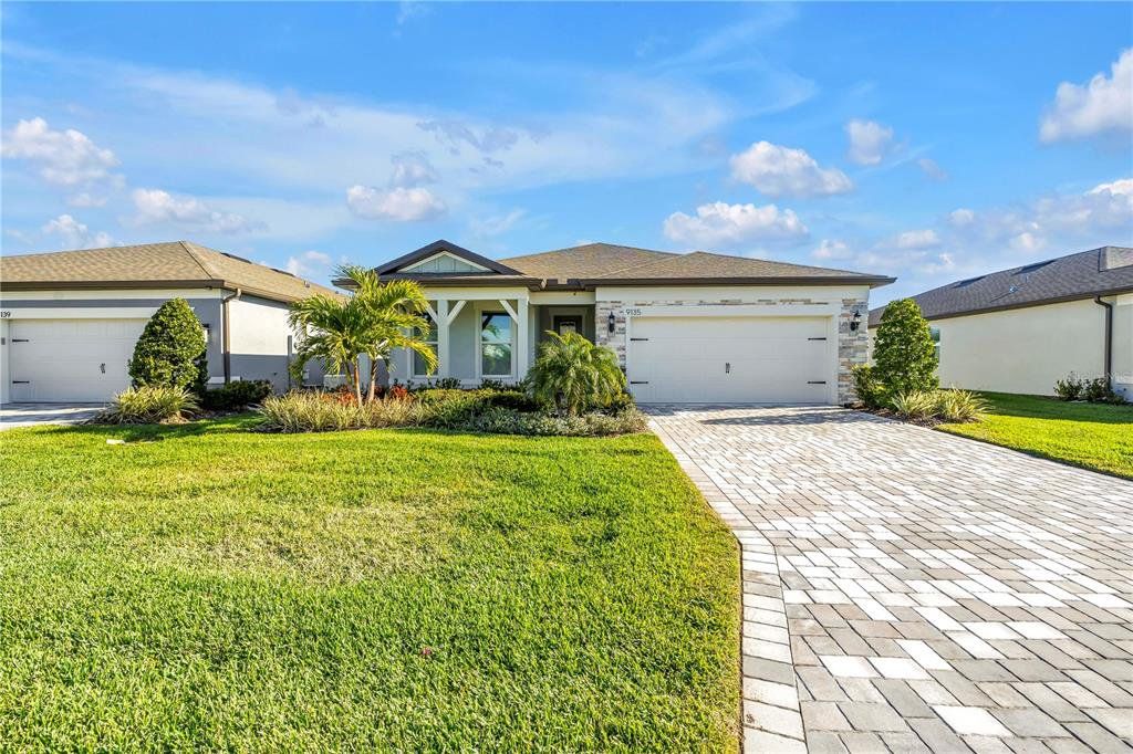 Front exterior of a new home in , Parrish, FL, highlighting curb appeal (Image 1). Front exterior of a new home in , Parrish, FL, highlighting curb appeal (Image 1).