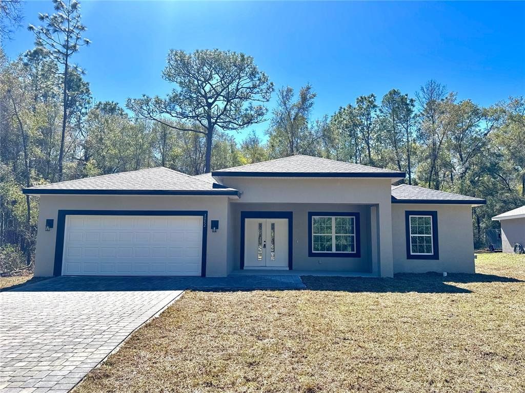 Front exterior of a new home in , Citrus Springs, FL, highlighting curb appeal (Image 1). Front exterior of a new home in , Citrus Springs, FL, highlighting curb appeal (Image 1).