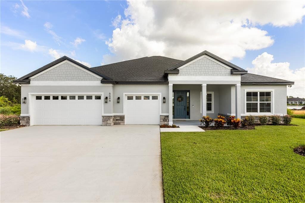 Front exterior of a new home in , Port Charlotte, FL, highlighting curb appeal (Image 1). Front exterior of a new home in , Port Charlotte, FL, highlighting curb appeal (Image 1).