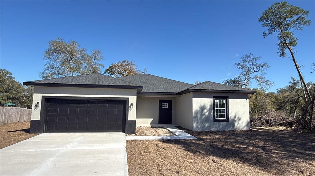 Front exterior of a new home in , Ocala, FL, highlighting curb appeal (Image 1). Front exterior of a new home in , Ocala, FL, highlighting curb appeal (Image 1).