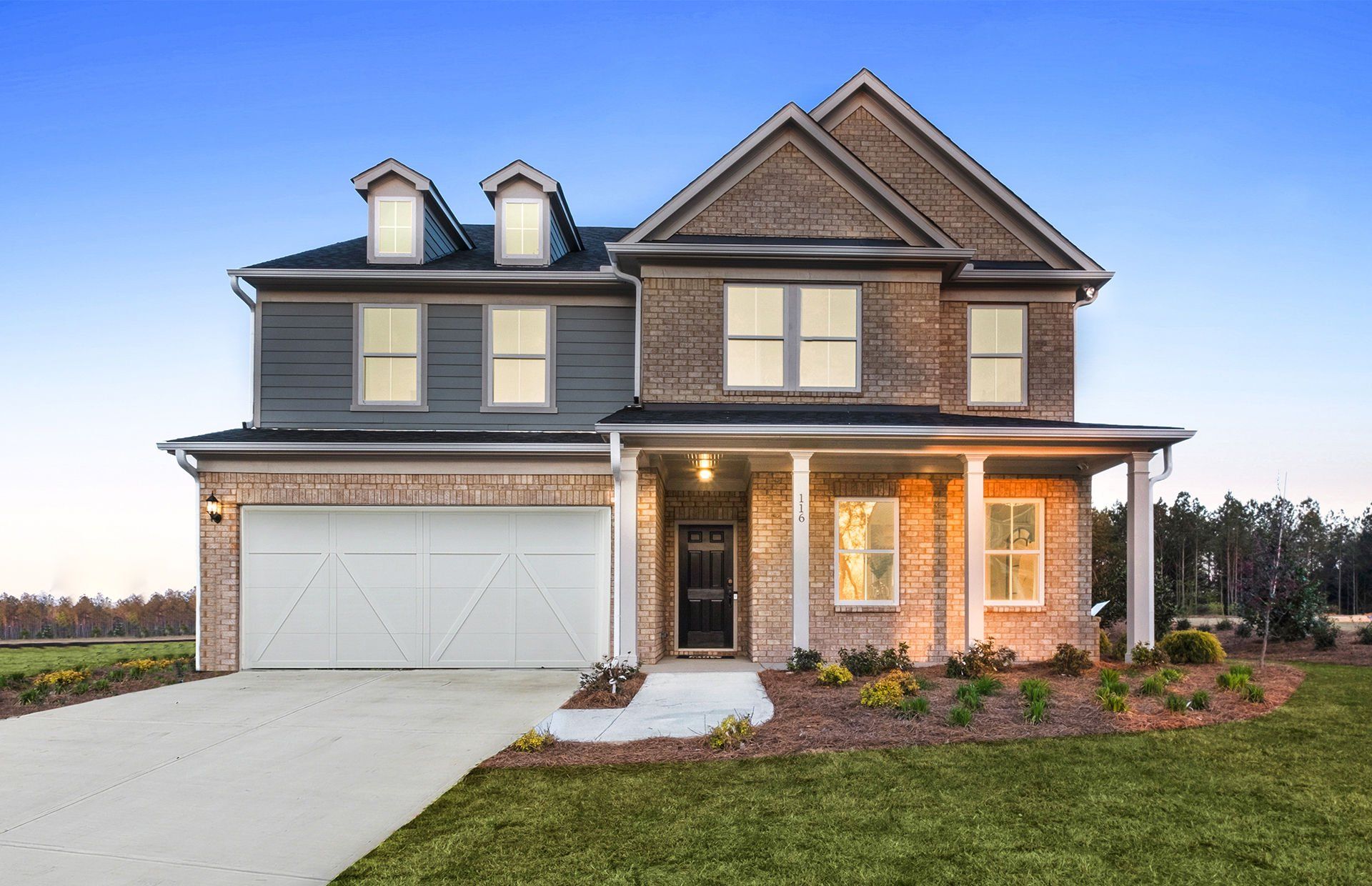 Front exterior of a new home in Hawthorne Ridge, McDonough, GA, highlighting curb appeal (Image 1). Front exterior of a new home in Hawthorne Ridge, McDonough, GA, highlighting curb appeal (Image 1).