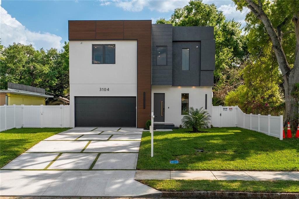 Front exterior of a new home in , Tampa, FL, highlighting curb appeal (Image 1). Front exterior of a new home in , Tampa, FL, highlighting curb appeal (Image 1).
