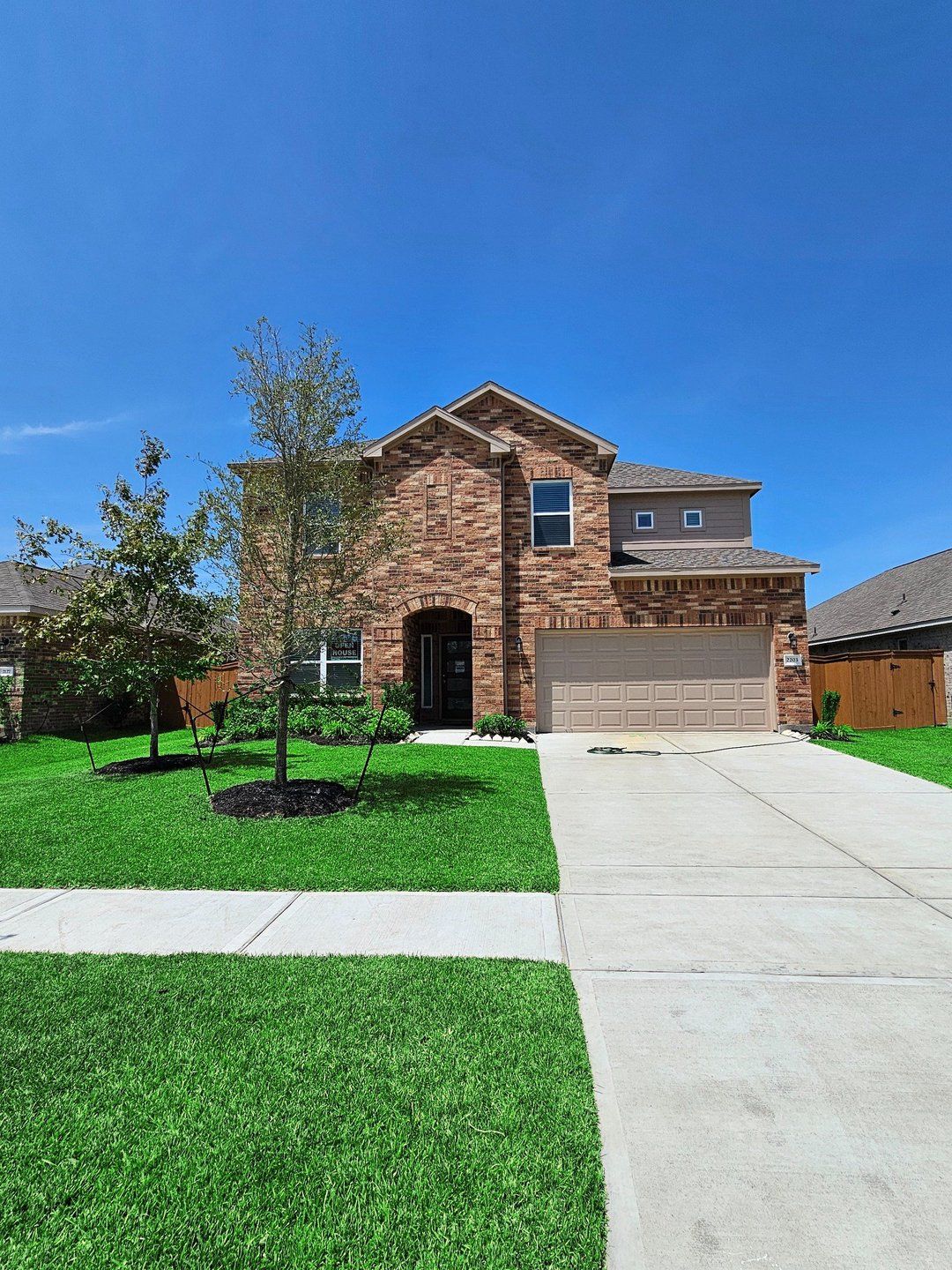 Front exterior of a new home in Lago Mar, Texas City, TX, highlighting curb appeal (Image 1). Front exterior of a new home in Lago Mar, Texas City, TX, highlighting curb appeal (Image 1).