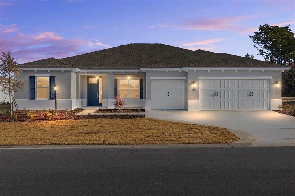Front exterior of a new home in On Top of the World Communities, Ocala, FL, highlighting curb appeal (Image 1). Front exterior of a new home in On Top of the World Communities, Ocala, FL, highlighting curb appeal (Image 1).
