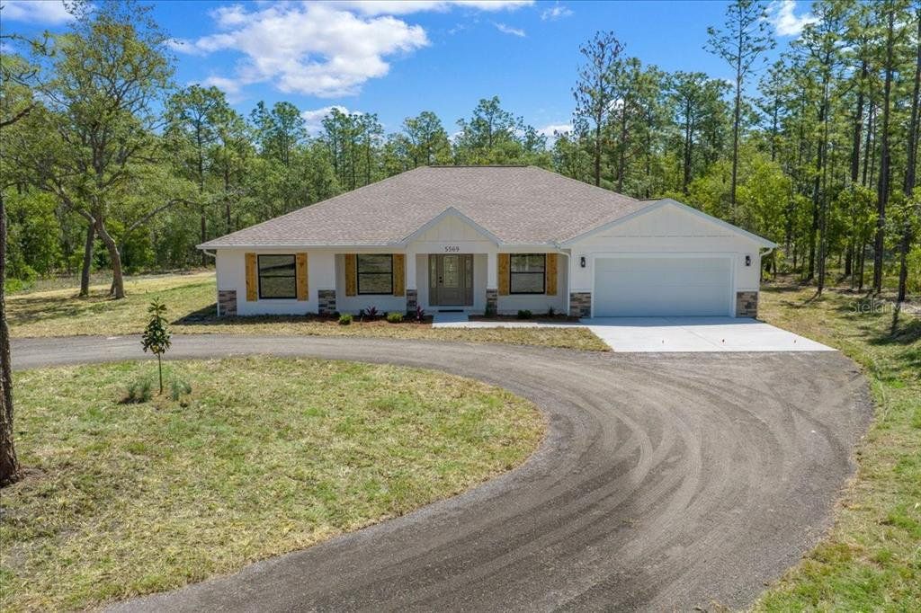 Front exterior of a new home in , Ocala, FL, highlighting curb appeal (Image 1). Front exterior of a new home in , Ocala, FL, highlighting curb appeal (Image 1).