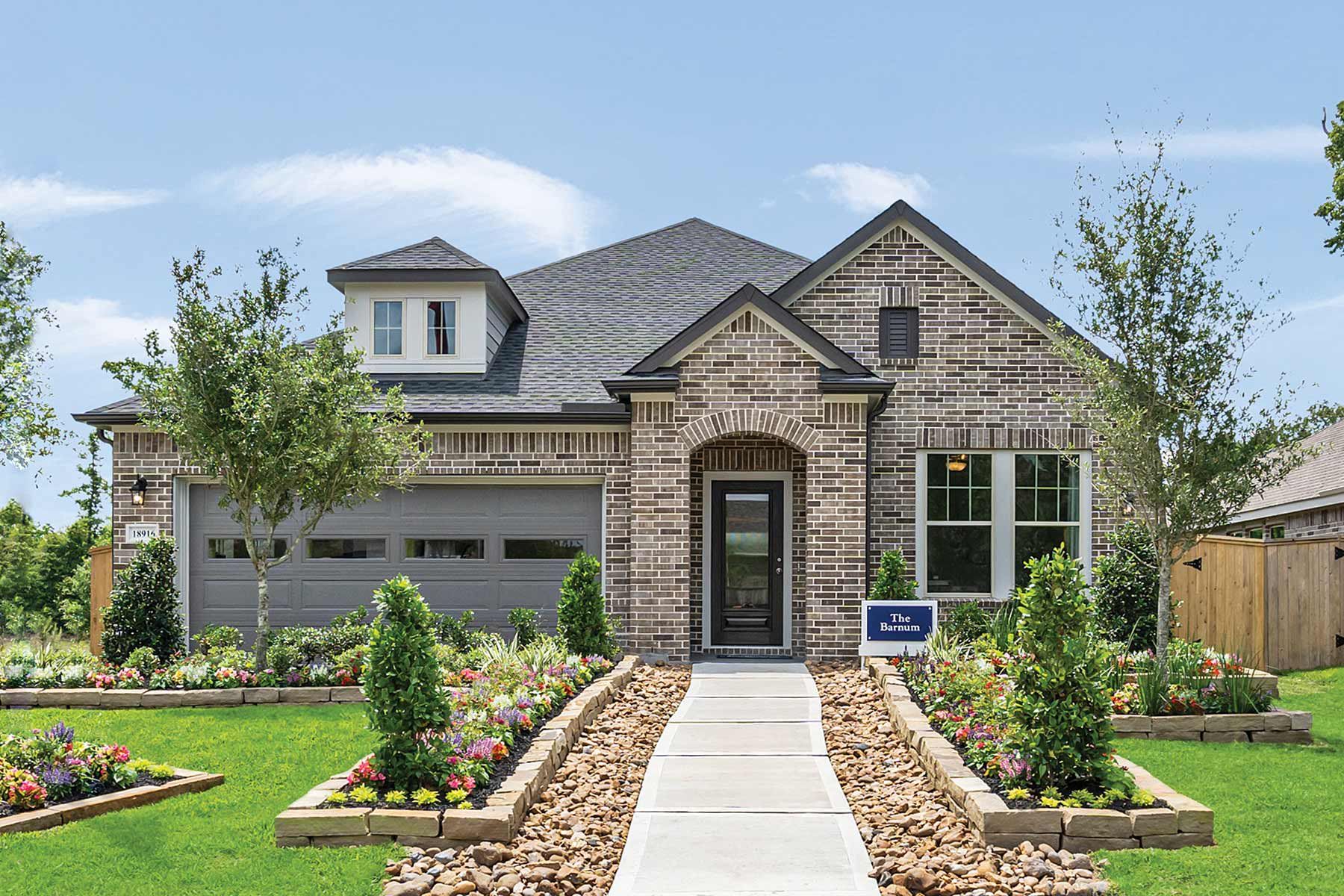 Representative exterior photo of a completed home built from the The Barnum by David Weekley Homes in Escondido 50' Homesites, Magnolia, TX (Image 1). Representative exterior photo of a completed home built from the The Barnum by David Weekley Homes in Escondido 50' Homesites, Magnolia, TX (Image 1).