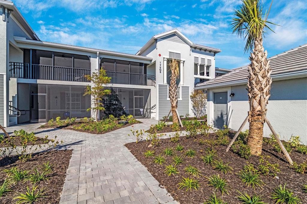 Front exterior of a new home in Wellen Park Golf & Country Club, Venice, FL, highlighting curb appeal (Image 1). Front exterior of a new home in Wellen Park Golf & Country Club, Venice, FL, highlighting curb appeal (Image 1).