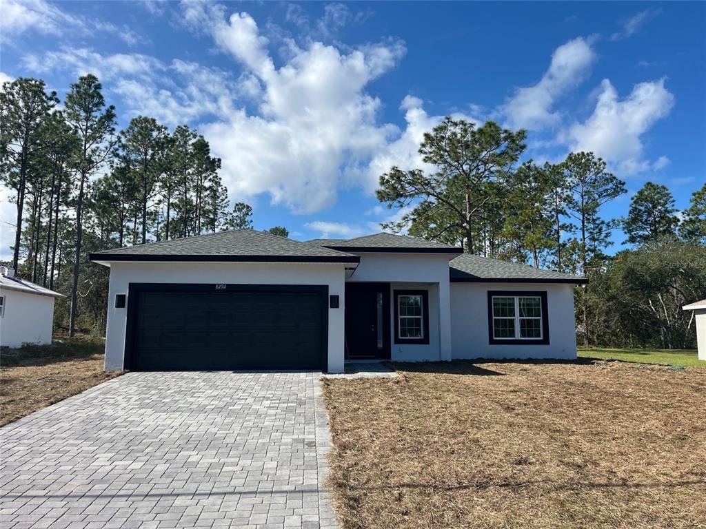 Front exterior of a new home in , Citrus Springs, FL, highlighting curb appeal (Image 1). Front exterior of a new home in , Citrus Springs, FL, highlighting curb appeal (Image 1).