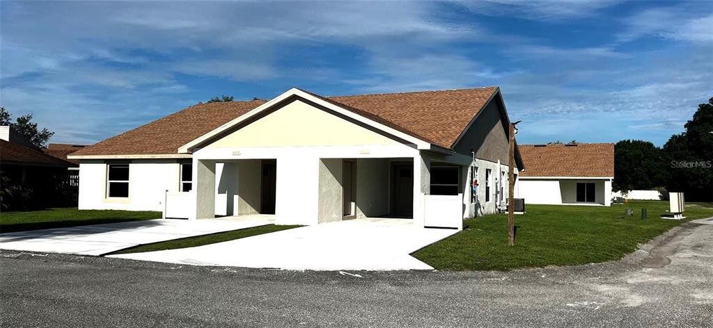 Front exterior of a new home in , Mulberry, FL, highlighting curb appeal (Image 1). Front exterior of a new home in , Mulberry, FL, highlighting curb appeal (Image 1).