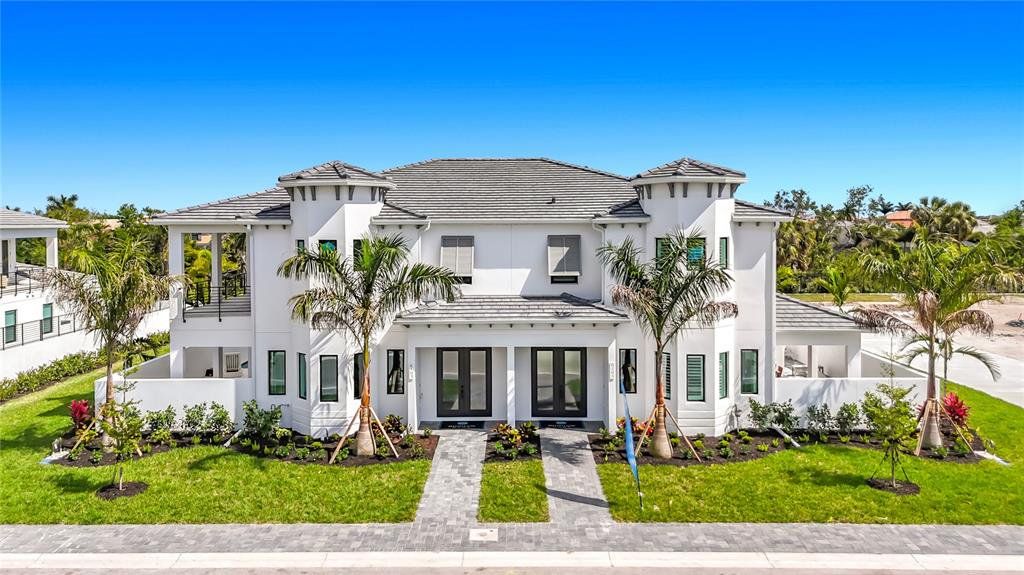 Front exterior of a new home in Aqua, Bradenton, FL, highlighting curb appeal (Image 1). Front exterior of a new home in Aqua, Bradenton, FL, highlighting curb appeal (Image 1).