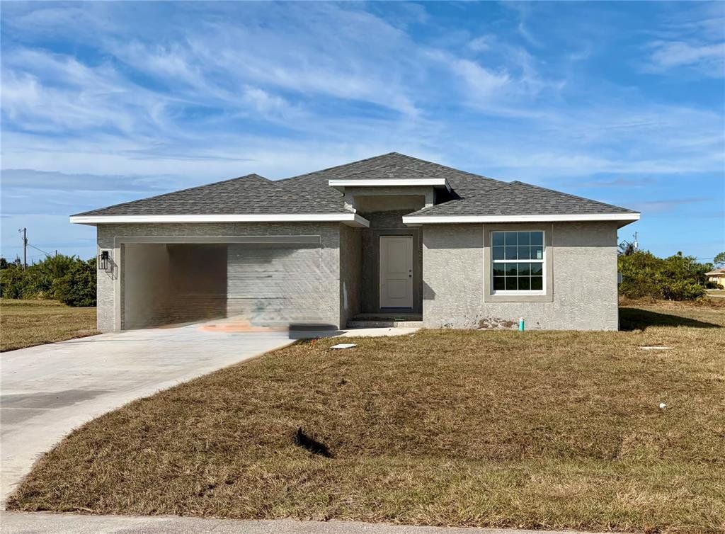 Front exterior of a new home in , Rotonda West, FL, highlighting curb appeal (Image 1). Front exterior of a new home in , Rotonda West, FL, highlighting curb appeal (Image 1).
