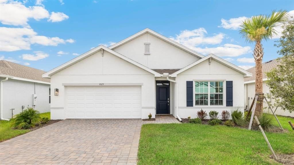 Front exterior of a new home in Seagrass - Express & Tradition, Punta Gorda, FL, highlighting curb appeal (Image 1). Front exterior of a new home in Seagrass - Express & Tradition, Punta Gorda, FL, highlighting curb appeal (Image 1).