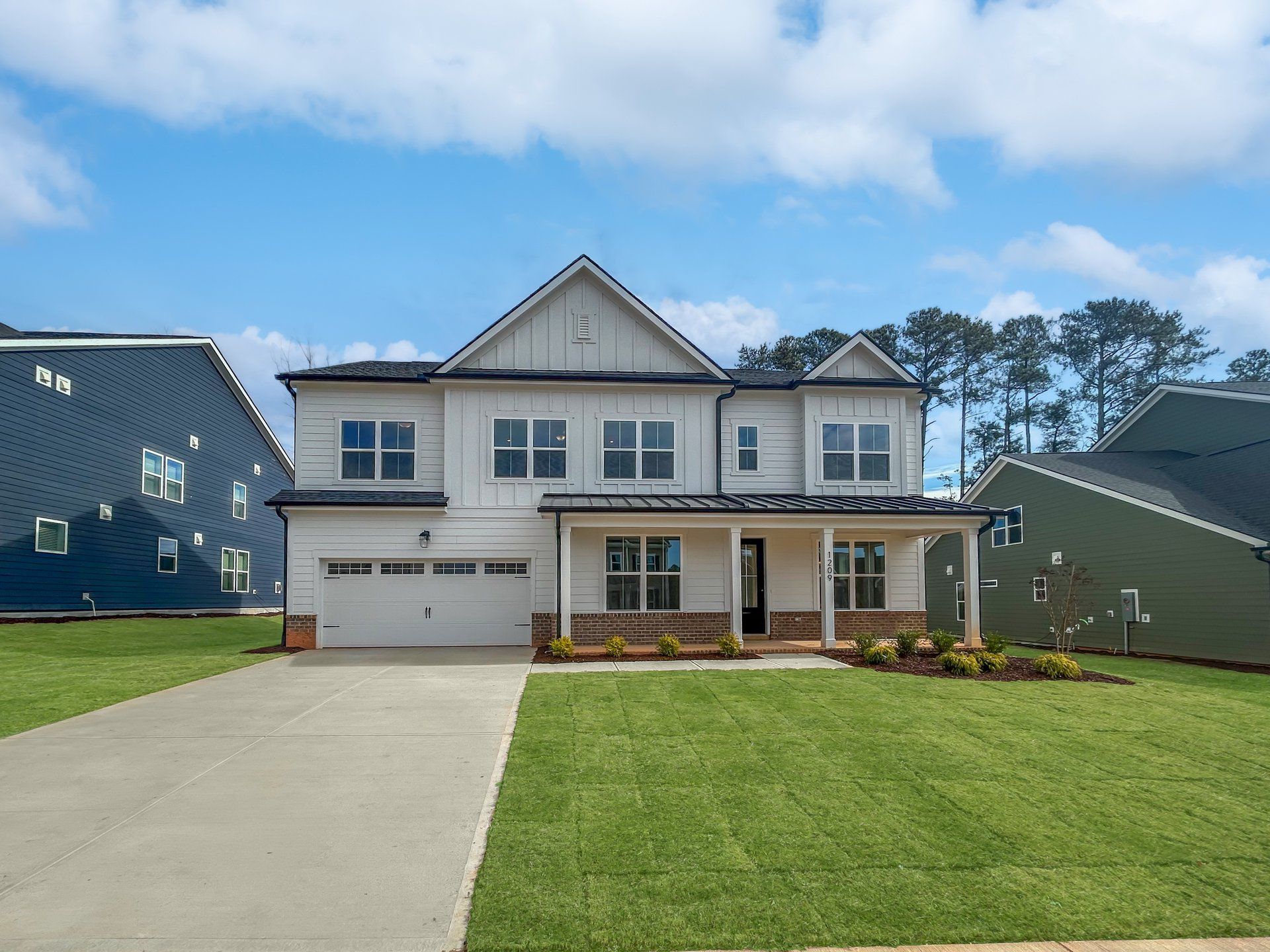 Front exterior of a new home in Stonewood Estates: Landmark, Durham, NC, highlighting curb appeal (Image 1).