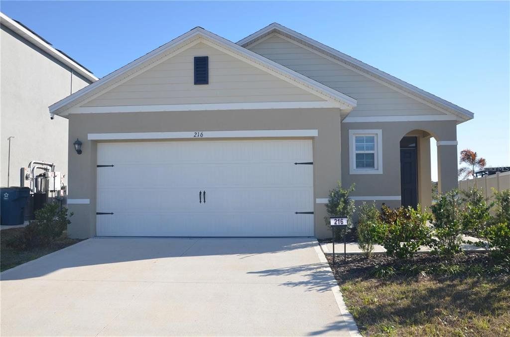 Front exterior of a new home in , Davenport, FL, highlighting curb appeal (Image 1). Front exterior of a new home in , Davenport, FL, highlighting curb appeal (Image 1).