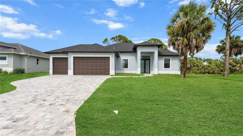 Front exterior of a new home in , Rotonda West, FL, highlighting curb appeal (Image 1). Front exterior of a new home in , Rotonda West, FL, highlighting curb appeal (Image 1).