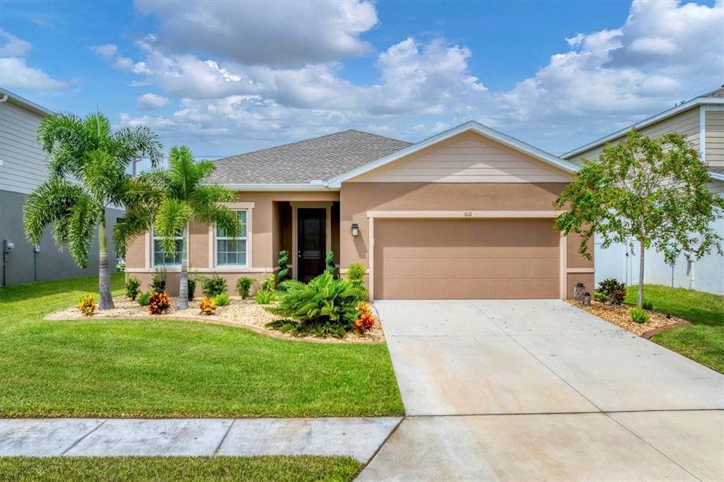 Front exterior of a new home in , Parrish, FL, highlighting curb appeal (Image 1). Front exterior of a new home in , Parrish, FL, highlighting curb appeal (Image 1).